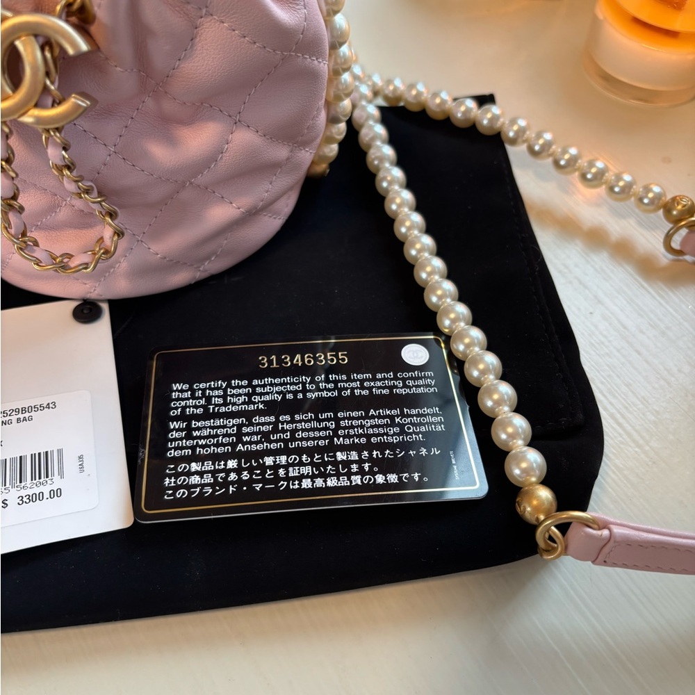 CHANEL Light Pink Quilted Mini Drawstring Bag with Pearl Chain. Never Used. - Picture 11 of 16